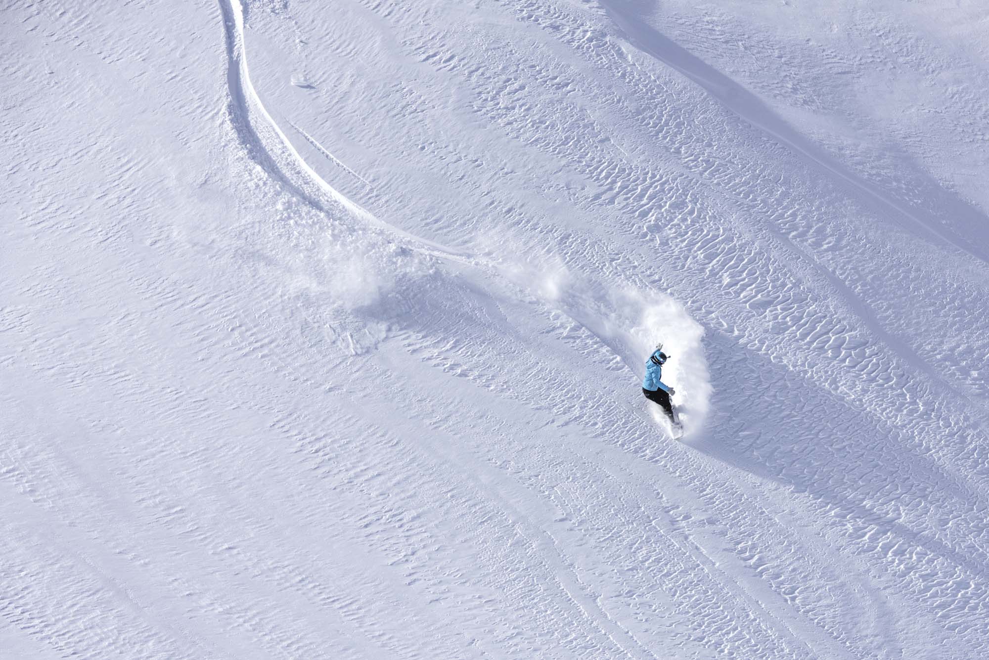 Skier skiing off-piste on a beautiful mountain slope